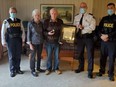 Bracebridge Ontario Provincial Police (OPP) detachment commander Inspector Burton along with Superintendent Houliston presented 80 year-old Norman Ruff of Port Carling with a Citation for Bravery on behalf of OPP Commissioner Carrique on Tuesday October 26, 2021. Photo: Ontario Provincial Police