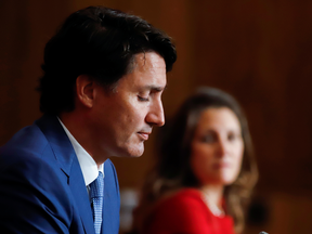 Canada's Deputy Prime Minister Chrystia Freeland, watches Prime Minister Justin Trudeau answer a question at a news conference in Ottawa, on October 6, 2021.