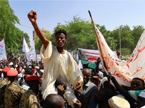 Sudanese protesters take part in a rally demanding the dissolution of the transitional government, outside the presidential palace in Khartoum on October 16, 2021.