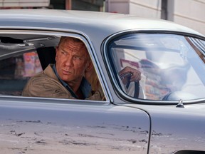 James Bond (Daniel Craig) and Dr. Madeleine Swann (Lea Seydoux) drive through Matera, Italy in No Time to Die.
