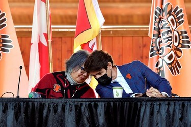 Canada's Prime Minister Justin Trudeau and National Chief of the Assembly of First Nations RoseAnne Archibald at the Tk'emlups PowWow Arbour in B.C., Oct. 18, 2021.