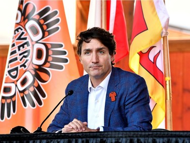 Canada's Prime Minister Justin Trudeau speaks to the press and Tk'emlups te Secweepemc community members and First Nations leaders at the Tk'emlups Pow wow Arbour in B.C., Oct. 18, 2021.