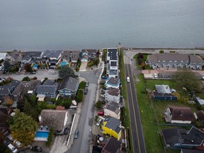 Homes on Boundary Bay in Delta, left, and Point Roberts, Wash., right, are separated by the Canada-U.S. border which is just north of Roosevelt Way, centre, in Point Roberts, as seen in an aerial view on Wednesday, October 13, 2021. Point Roberts sits on a peninsula and is only accessible by land by travelling through Canada.