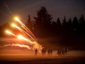 A group of young men shoot off fireworks on Halloween night 2020 in Vancouver. A ban on the sale and use of consumer fireworks went into effect the following day.