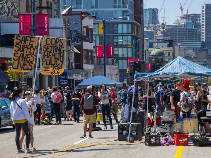  Members of the Drug User Liberation Front and the Vancouver Area Network of Drug Users hand out a safe supply of drugs to members of the DTES community. (Francis Georgian / Postmedia)