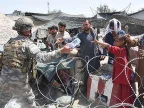 Soldiers of Turkish Task Force in Afghanistan were on duty in and around Hamid Karzai International Airport to help people who are waiting for evacuation, in Kabul, Afghanistan on Aug. 23, 2021.