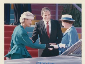 Oct. 15, 1987. British Columbia's Premier Bill Vander Zalm introduces his wife Lillian (left) to Queen Elizabeth during a Royal Visit to B.C. Someone has written "proof" on the print in blue "grease pencil," to let an editor see the image when they were choosing photos for the paper. But it never ran. Peter Hulbert/Province