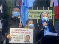 Turnisa Sulayman-Qira of the Vancouver Uyghur Association, her husband and son protest the Chinese Communist Party at the Chinese Consulate in Vancouver on Oct. 1.