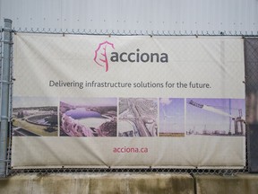 A sign of the Spanish multinational company Acciona on a fence at the wastewater treatment plant's construction site in North Vancouver.