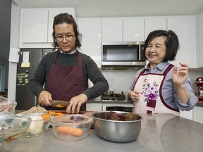 Kevin Huang and his mom Julia Wang prepare traditional Taiwanese dishes at Wang's home in North Vancouver.