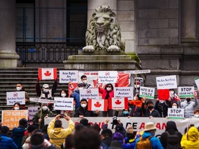 Protesters rally outside the Vancouver Art Gallery last March against anti-Asian hate. The total number of anti-East Asian hate incidents collected by the Vancouver Police Department’s special unit for 2020 was 98, up from 12 in 2019.