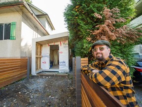 Mat Turner, co-owner of Lanefab, at the skinny lot in Vancouver that his company bought. in the background is the "office pod" they built on the property but have been told to tear down by Vancouver's planning department.