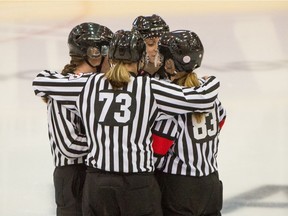 Referees Grace Barlow and Megan Howes with lines-persons Melissa Brunn Colleen Geddes officiate a BCHL Junior A game between the Langley Rivermen and the Surrey Eagles at South Surrey Arena in Surrey, BC, Oct. 17, 2021.