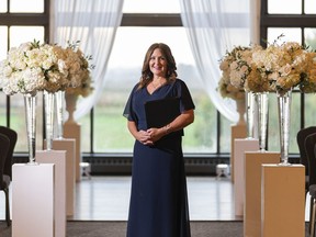 Wedding officiant Kristen Olynick, poses for a photo prior to officiating a wedding at Swaneset Golf Course in Pitt Meadows on Sunday.