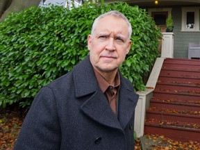 VANCOUVER, BC - Oct. 27, 2021  - Tyman Stewart in front of his home in Vancouver, BC, Oct. 27, 2021. Stewart is upset that rezoning being rammed through may bring about massive land assemblies and he will lose his home.

(Arlen Redekop / PNG staff photo) (story by reporter) [PNG Merlin Archive]