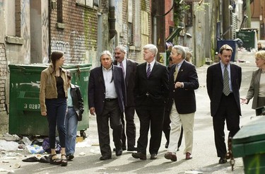 John Manley (CENTRE), Philip Owen (TO RIGHT) and Leonard George (TO LEFT) tour downtown Eastside in 2003.