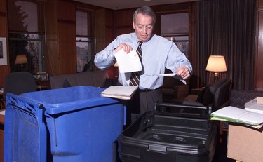 2002. Two recycle bins help outgoing mayor Philip Owen as he sorts through the boxes of paperwork at his City Hall office.