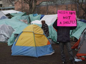 Residence of a homeless camp are shown in Victoria on Monday, January 11, 2016.