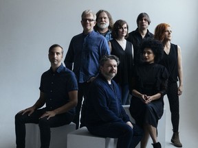 The New Pornographers: Bottom row, sitting, from left: Joe Seiders, Blaine Thurier and Simi Sernaker. Top row, standing from left: Carl Newman, John Collins, Kathryn Calder, Todd Fancey and Neko Case.