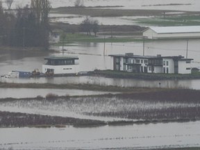 Flood water surround a home in the Sumas area of Abbotsford this week.