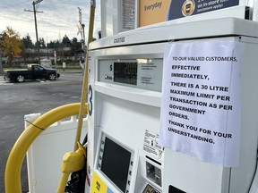 A sign is posted on a gas pump notifying customers of a 30 litre limit on fuel purchases on November 21, 2021 in Abbotsford.