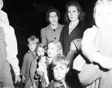 1948 Fraser River Flood - Rosedale - A group of women and children in coats stand facing the camera. 1948. Vancouver Sun. (48/1183)