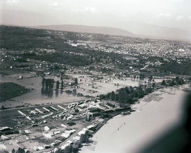 1948 Fraser River Flood - Trapp Rd. & BCE Barns - Aerial view of flooding. 1948. Vancouver Sun.