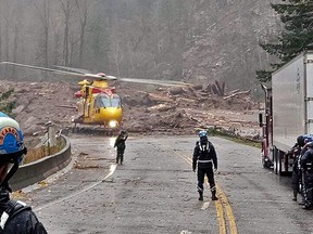 Mike Stronach, a Langley firefighter and his 12-year-old daughter were airlifted from the slide area aboard an RCAF Cormorant helicopter with hundreds of other people trapped by double mudslide on Hwy. 7