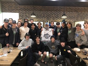 The Fraser Valley Thunderbirds U18 AAA team presents a jersey to Bill Miller, one of the owner of Ricky's All Day Grill in Hope.