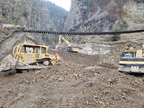 Heavy equipment works to repair one of the section of the Trans-Canada Highway most damaged by last week's flooding in B.C.