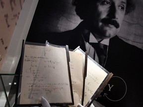 A picture taken on Nov. 22, 2021 shows pages of one of the preparatory manuscript to the theory of general relativity of Albert Einstein, during their presention a day before being auctionned at Christie's auction house in Paris.
