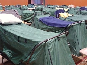 Rows of beds at an emergency shelter in Chilliwack, where more than 100 migrant farm workers have ben evacuated to.