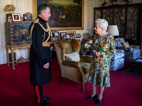 Britain's Queen Elizabeth II greets Britain's Chief of the Defence Staff, General Sir Nick Carter, during an audience at Windsor Castle, west of London, Wednesday, Nov. 17, 2021. AFP via Getty Images