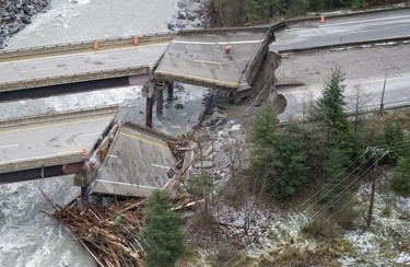 In this aerial photo, damage caused by heavy rains and mudslides earlier in the week is pictured along the Coquihalla Highway near Hope, British Columbia, Thursday, Nov. 18, 2021.
