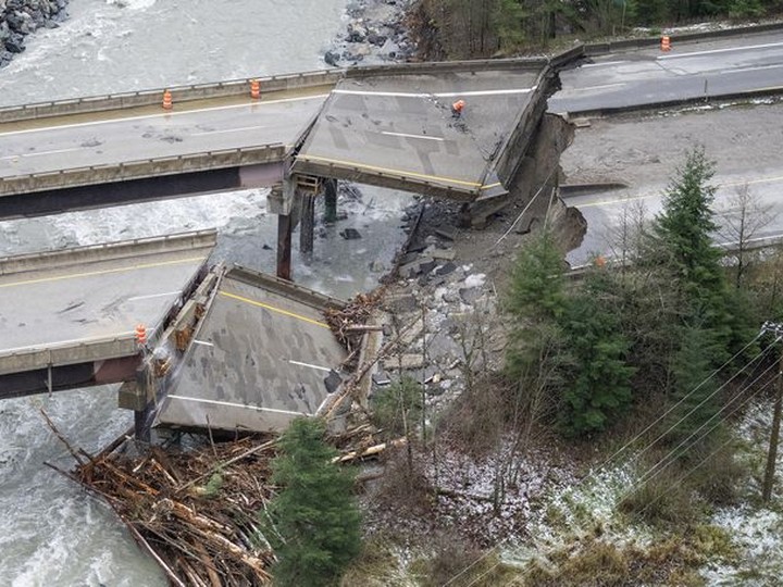  In this aerial photo, damage caused by heavy rains and mudslides earlier in the week is pictured along the Coquihalla Highway near Hope, British Columbia, Thursday, Nov. 18, 2021.