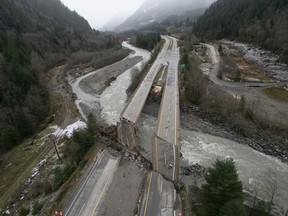 Damage caused by heavy rains and mudslides earlier in the week is pictured along the Coquihalla Highway near Hope, B.C., Thursday, November 18, 2021.
