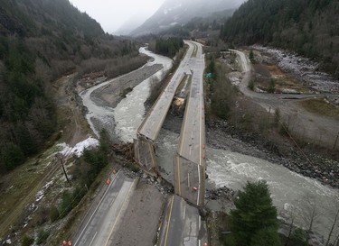 Damage caused by heavy rains and mudslides earlier in the week is pictured along the Coquihalla Highway near Hope, B.C., Thursday, November 18, 2021.