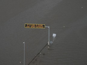 A flooded highway 1 in Abbotsford, B.C., Tuesday, Nov. 16, 2021.