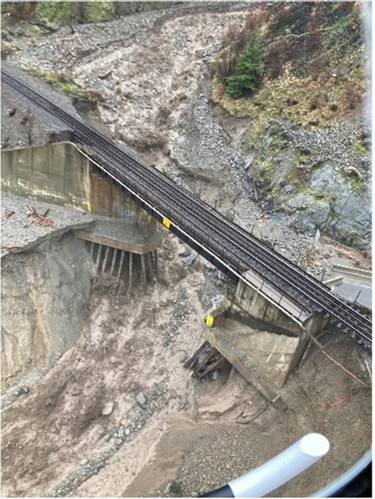 An aerial view shows a damaged road as a flood sweeps through, near Lytton, British Columbia, Canada, November 15, 2021.