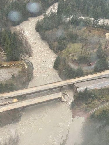 An aerial view shows a washed out bridge on the Coquihalla Highway as a flood sweeps through, near Carolin Mine Road, British Columbia.