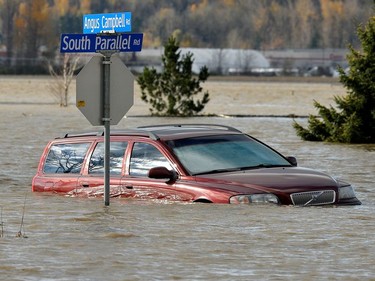 A vehicle is submerged in water after rainstorms caused flooding and landslides in Abbotsford, British Columbia, Canada November 16, 2021.
