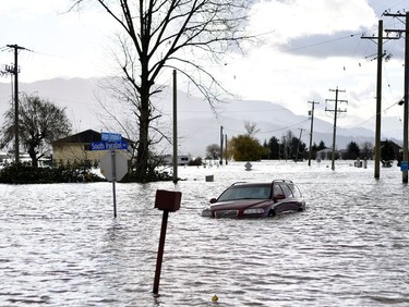 South Parallel road is submerged in flood water after rainstorms caused flooding and landslides in Abbotsford, British Columbia, Canada November 16, 2021.