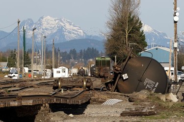 A railroad tank cars lies on its side where tracks were damaged, after rainstorms hit both British Columbia and Washington state causing flooding on both sides of the border, in Sumas, Washington, U.S. November 17, 2021.