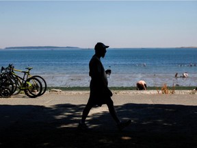 People look for ways to cool off at Willows Beach in Victoria during on June 28, 2021, when a heat dome hovered over B.C., setting record temperatures across the province.