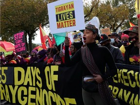 Selome Girma chants as she marches with others in protest of the civilian casualties and abuses caused as a result of a war that has so far lasted a year in Ethiopia's northern region of Tigray, near the U.S. Capitol building in Washington, U.S., November 4, 2021.