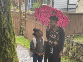 Rumbie Muzofa looks down at Neemah Muzofa in the Vancouver-filmed feature Evelyne, about African women and immigrants’ experience in Canada, screening at the 2021 Whistler Film Festival. ‘It’s loosely based on my own life experiences,’ says the elder Muzofa.