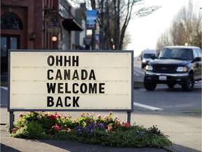 A sign welcoming Canadians is pictured at a gas station as Canadian travellers cross the border as the U.S. reopens land borders to coronavirus disease (COVID-19) vaccinated travellers for the first time since the COVID-19 restrictions were imposed, at the Peace Arch border crossing in Blaine, Washington, U.S. Nov. 8, 2021.