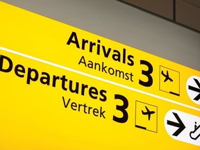 The "Arrivals" and "Departures" boards are pictured at Schiphol airport after Dutch health authorities said that 61 people who arrived in Amsterdam on flights from South Africa tested positive for the coronavirus disease (COVID-19), in Amsterdam, Netherlands, November 27, 2021.