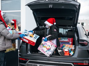 Jonathan (Bear) Yeung, 11, organizes donated toys that he gave to B.C. Children's Hospital in 2020. He is collecting donations again this year. Source: Handout photo