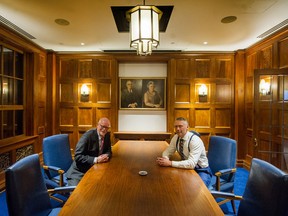 Donald Luxton, left, and Drew Ratcliffe in the restored art deco boardroom from the Georgia Medical Dental Building, which was torn down in 1989. The boardroom was salvaged and has been installed in a new building at 1575 West Georgia St. Ratcliffe's grandfather, Arne Matheson, saved the boardroom, and portraits of Matheson and his wife were put up in the room.
